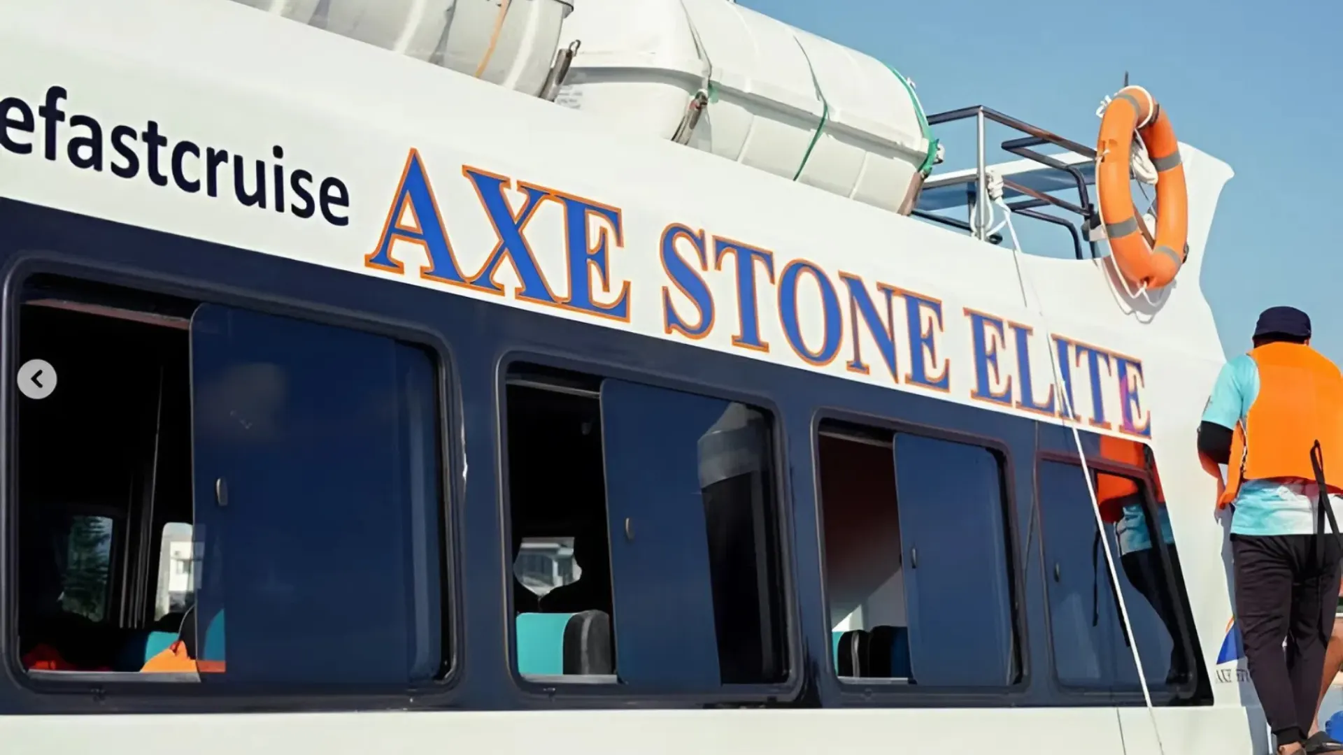 Axe Stone Elite premium vessel by Axe Stone Fast Cruise docked at Sanur Harbour, ready for Fast Boat to Nusa Penida departure with sleek modern hull design and safety equipment visible