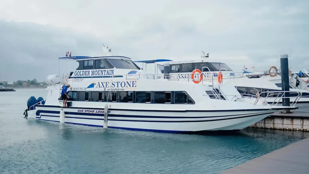 Axe Stone Legend fast boat operated by Axe Stone Fast Cruise navigating Bali strait as premium Fast Boat Sanur to Nusa Penida service, featuring modern design and smooth ride with 100 passenger capacity