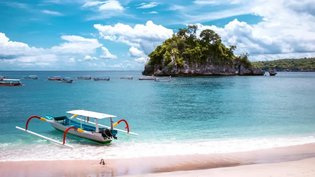 Vibrant water at Crystal Bay Nusa Penida showcasing colorful tropical fish and excellent underwater visibility, a premier snorkeling and diving destination where visitors can encounter rare Mola Mola sunfish during season, reachable with Axe Stone Fast Cruise fast boat service from Bali mainland.